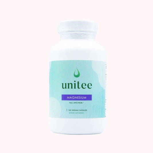 A white bottle with a green label that reads 'unitee MAGNESIUM Full Spectrum', with 120 vegan capsules.